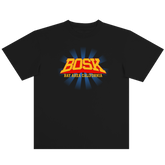 The Super Power Tee by BOSK is a black, heavy-weight cotton shirt with bold yellow and orange "BOSK" text above "BAY AREA CALIFORNIA" in yellow, plus blue rays radiating across the classic-fit chest.